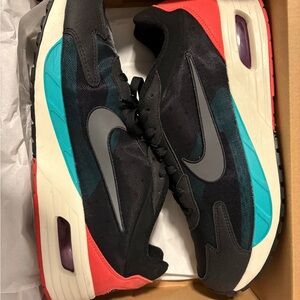Nike Black and Teal Sneakers with Red Accents